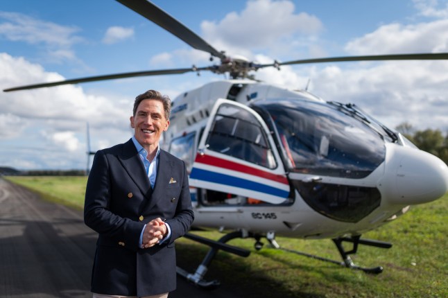 Undated BBC Handout Photo from Destination X. Pictured: Rob Brydon. PA Feature SHOWBIZ TV Destination X. WARNING: This picture must only be used to accompany PA???Feature SHOWBIZ TV Destination X. PA Photo. Picture credit should read: BBC/TwoFour. NOTE TO EDITORS: This picture must only be used to accompany PA Feature SHOWBIZ TV Destination X. WARNING: Use of this copyright image is subject to the terms of use of BBC Pictures' BBC Digital Picture Service. In particular, this image may only be published in print for editorial use during the publicity period (the weeks immediately leading up to and including the transmission week of the relevant programme or event and three review weeks following) for the purpose of publicising the programme, person or service pictured and provided the BBC and the copyright holder in the caption are credited. Any use of this image on the internet and other online communication services will require a separate prior agreement with BBC Pictures. For any other purpose whatsoever, including advertising and commercial prior written approval from the copyright holder will be required. Editors please note: This picture is strictly embargoed until Tuesday, July 22 at 00:00.