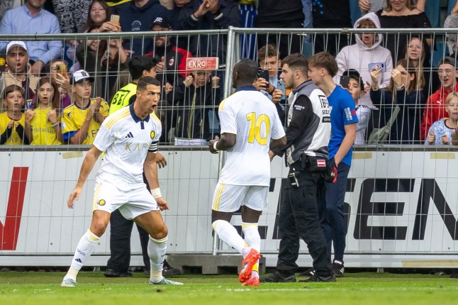 Saudi Pro League football club Al-Nassr's Portuguese forward Cristiano Ronaldo celebrates scoring with his teammate Nassr's Senegalese Forward #10 Sadio Mane during a friendly football match between Al Nassr FC and FC Toulouse in Groedig, Austria on July 30, 2025. (Photo by Johann GRODER / various sources / AFP) / Austria OUT (Photo by JOHANN GRODER/APA/EXPA/AFP via Getty Images)