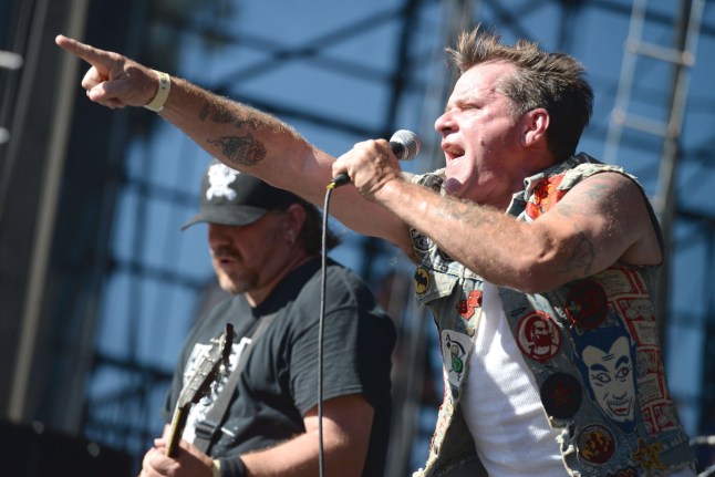 David Roach points at crowd as he sings on stage