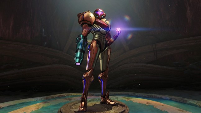 Metroid Prime 4 Samus standing in a dark room as her left fist glows purple
