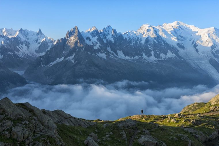 France, Mont Blanc, Lake Cheserys, hiker in front of Mount Blanc at sunrise