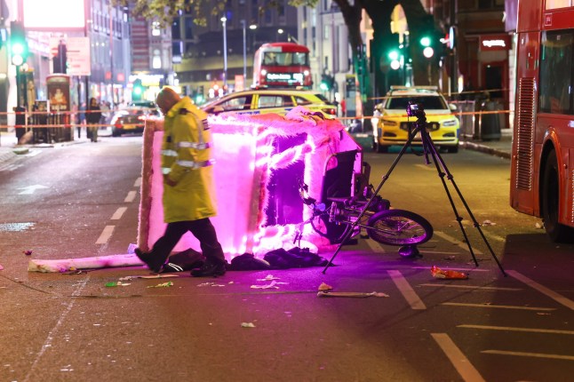 Three people are fighting for their lives after a rickshaw collided with a London bus in the heart of the West End during the early hours of the Bank Holiday Monday. Victims Rushed to Major Trauma Centres The crash happened on Charing Cross Road, WC2, shortly after midnight. The rickshaw rider and two passengers sustained critical injuries and were treated at the roadside for some time by police officers and paramedics before being rushed to major trauma centres in central London. Rickshaw Rider and Two Passengers Fighting for Their Lives After Collision with London Bus in Charing Cross Police confirmed that officers remain with the injured parties at hospital. Rickshaw Rider and Two Passengers Fighting for Their Lives After Collision with London Bus in Charing Cross Full Collision Investigation Specialist officers from the Metropolitan Police Alperton Traffic Garage and the Forensic Collision Investigation Unit are leading enquiries. A full collision reconstruction is underway at the scene. Rickshaw Rider and Two Passengers Fighting for Their Lives After Collision with London Bus in Charing Cross The road remains closed, with diversions affecting night bus routes N29, N20, N5, N279 and 24 towards Trafalgar Square. The closure is expected to continue for several hours. Awaiting Official Updates The Metropolitan Police and London Ambulance Service have been approached for an official statement but have not yet released further details on the victims??? conditions. Rickshaw Rider and Two Passengers Fighting for Their Lives After Collision with London Bus in Charing Cross A Met?? Police source at the Scene said: ???Our specialist collision investigators are working to establish the full circumstances of this very serious incident. We continue to appeal to anyone who may have witnessed the collision, or has dashcam or CCTV footage, to come forward.???