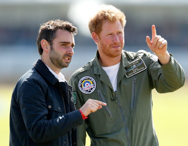 CHICHESTER, UNITED KINGDOM - SEPTEMBER 15: (EMBARGOED FOR PUBLICATION IN UK NEWSPAPERS UNTIL 48 HOURS AFTER CREATE DATE AND TIME) Prince Harry talks with Nick Loughran (Assistant Press Secretary to Prince William, Duke of Cambrige, Catherine, Duchess of Cambridge and Prince Harry) as they attend a Battle of Britain Flypast at Goodwood Aerodrome on September 15, 2015 in Chichester, England. The 75th Anniversary of the Battle of Britain is being marked by a historic flypast that brings more Battle of Britain aircraft together than ever before as a show of thanks to 'the few' and the sacrifices they made. (Photo by Max Mumby/Indigo/Getty Images)