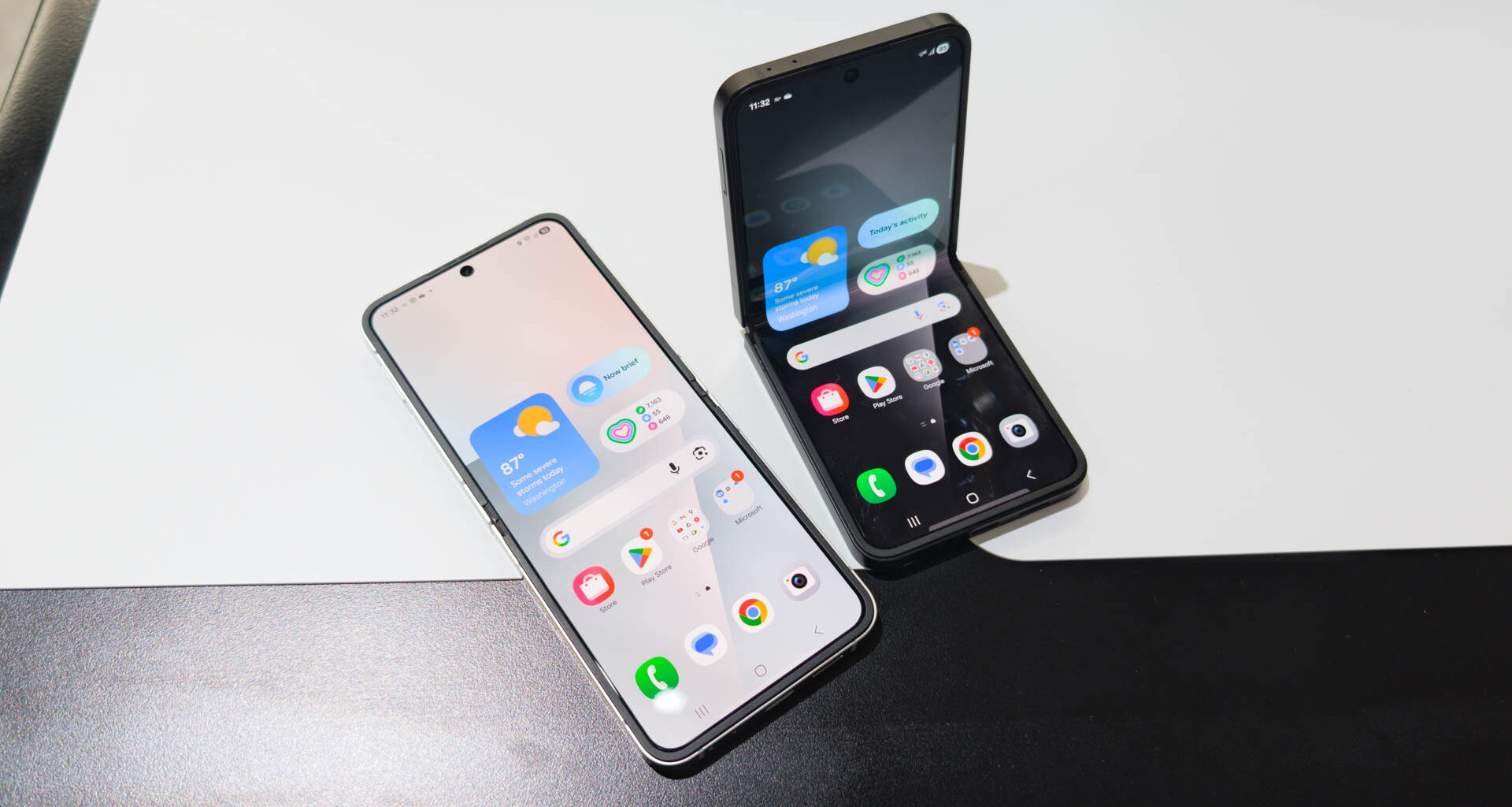 Samsung Galaxy Z Flip 7 FE in both Black and White colorways on table