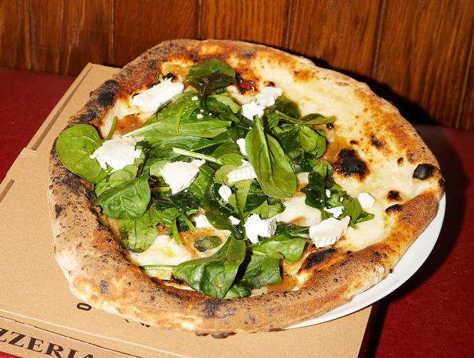 Santa Maria Pizza sat on a box