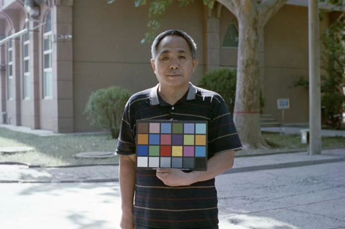 Man holding colour chart (Pic: China Lucky Film)