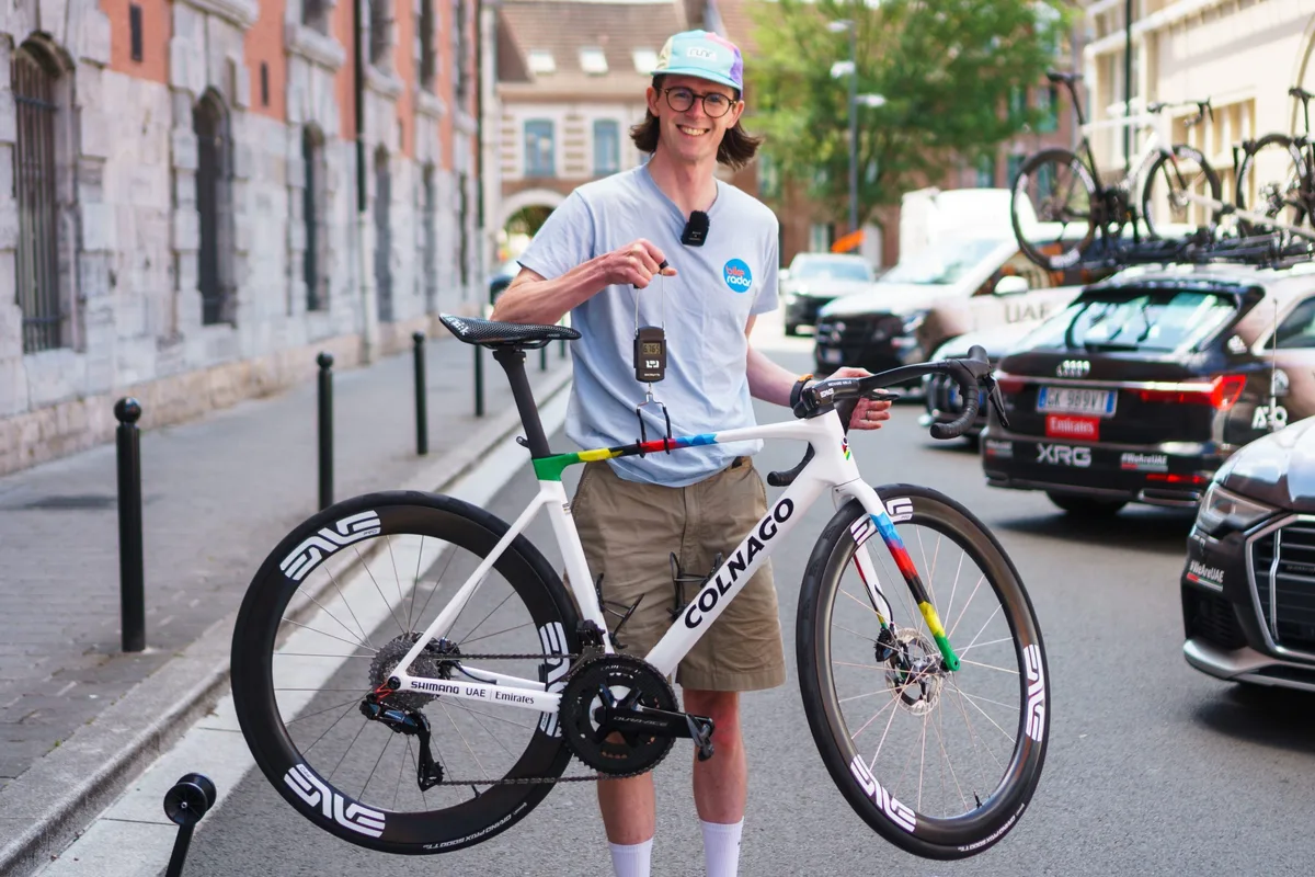 Simon von Bromley weighing Tadej Pogačar's Colnago V5Rs at the 2025 Tour de France