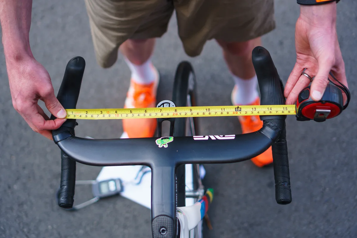 Measuring Tadej Pogačar's Colnago V5Rs handlebar at the 2025 Tour de France.