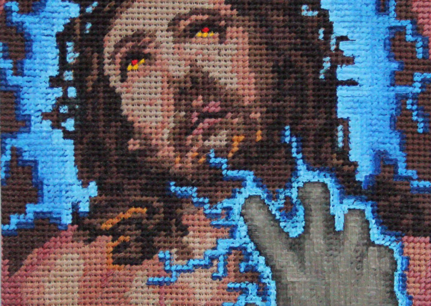Vojtêch Luksch blends violent retro video games with the “grandma-core” of embroidered canvases