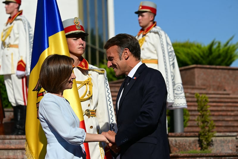 Moldova's president Maia Sandu welcomes France's president Emmanuel Macron in Chisinau. Photograph: Daniel Mihalescu/AFP via Getty Images