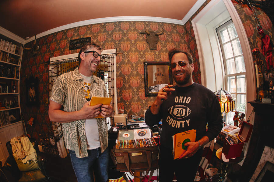 The Black Keys in a junk shop looking at 7" singles