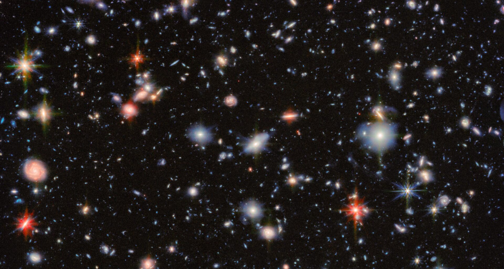 An area of deep space with thousands of galaxies in various shapes and sizes on a black background. Credit: ESA/NASA/CSA/the JADES Collaboration