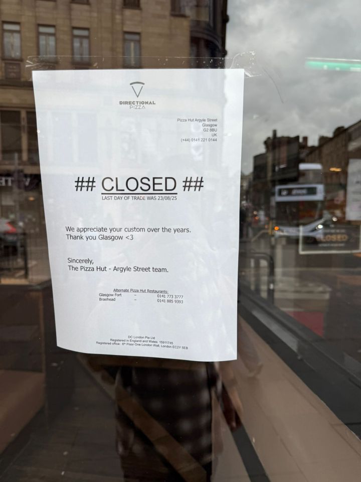 Photo of a sign on a Pizza Hut window announcing its closure.