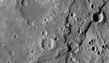 A gray image showing the fault lines, craters, and pockmarks on the surface of Mercury