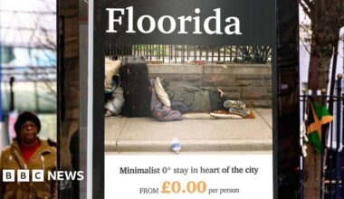 An advertising campaign shows a billboard with the slogan "Floorida". The poster has an image of someone sleeping on the ground, on a pavement, and reads "minimalist 0* stay in heart of the city". It has a made-up company name called Street Escapes.