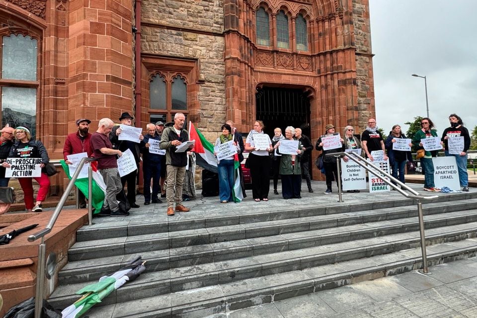 Protestors defy the ban against support for Palestine Action at the Guildhall in Derry on Saturday.