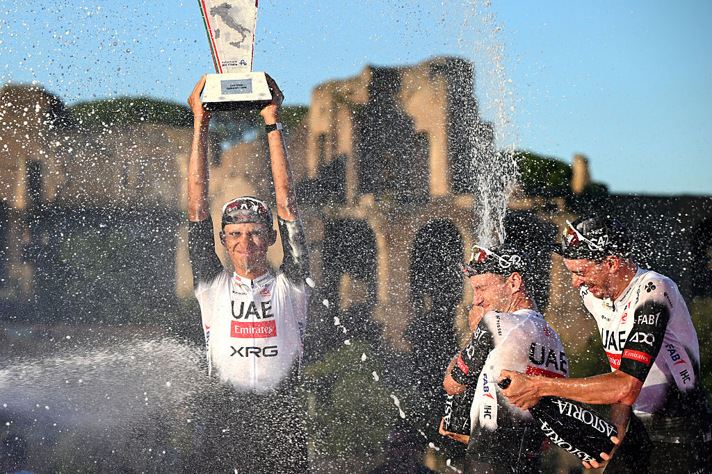ROME, ITALY - JUNE 01: Second place winner - Isaac Del Toro of Mexico, Adam Yates of Great Britain and Brandon McNulty of The United States of Team UAE Team Emirates - XRG celebrate at podium as best team during the 108th Giro d'Italia 2025, Stage 21 a 144.8km stage from Rome to Rome / #UCIWT / on June 01, 2025 in Rome, Italy. (Photo by Dario Belingheri/Getty Images)