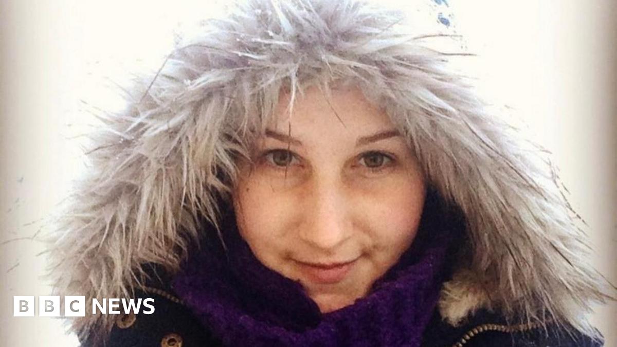 A young woman in her late 20s wearing a fluffy coat and looking into the camera.