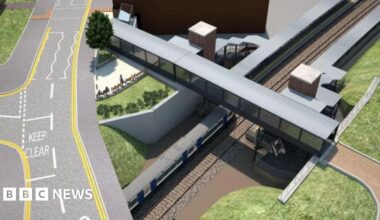 A drawing of a planned railway station seen from the air with a road running above a platform and a footbridge crossing the tracks