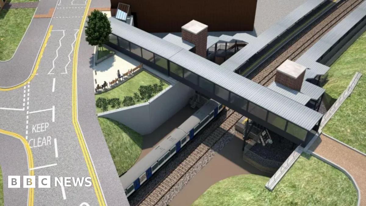A drawing of a planned railway station seen from the air with a road running above a platform and a footbridge crossing the tracks