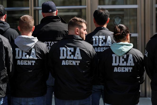 Members of the Drug Enforcement Administration (DEA) stand outside the Brooklyn Federal Courthouse in New York, on March 26, 2025.