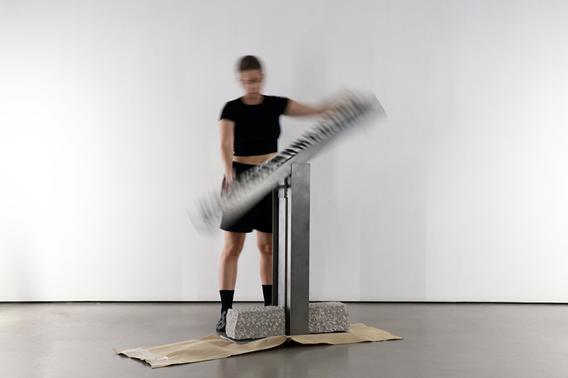 carved in steel and stone, sculptural electronic piano transforms from instrument to monolith