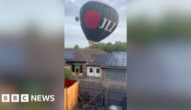 Balloon hitting top of a building