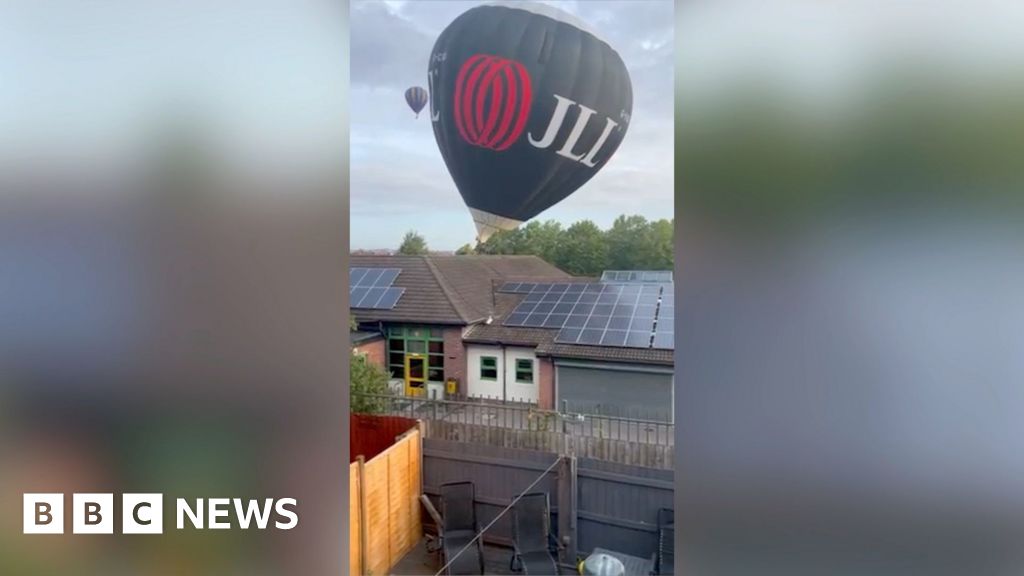 Balloon hitting top of a building