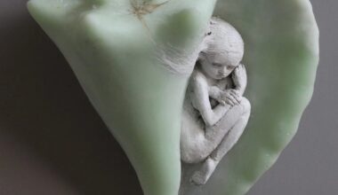 a small ceramic figure in a green shell