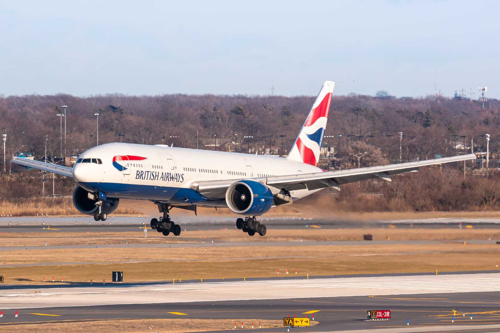 British Airways Boeing 777 landing at New York John F Kennedy International Airport JFK shutterstock_1674185902