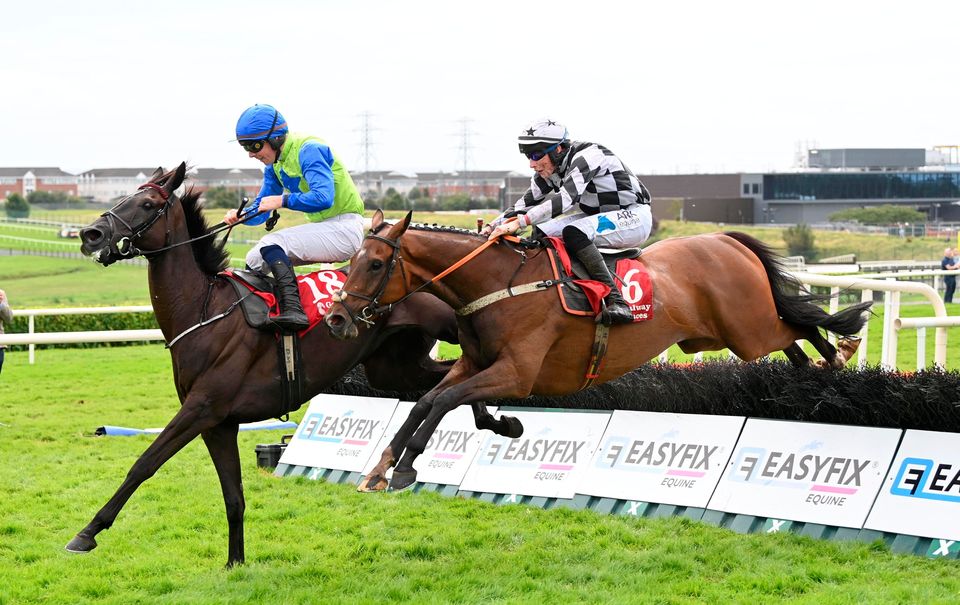 Ballystone ridden by Alex Harvey (right) on the way to winning the Kenny Galway Peugeot Handicap Hurdle at Galway. Photo: PA Wire