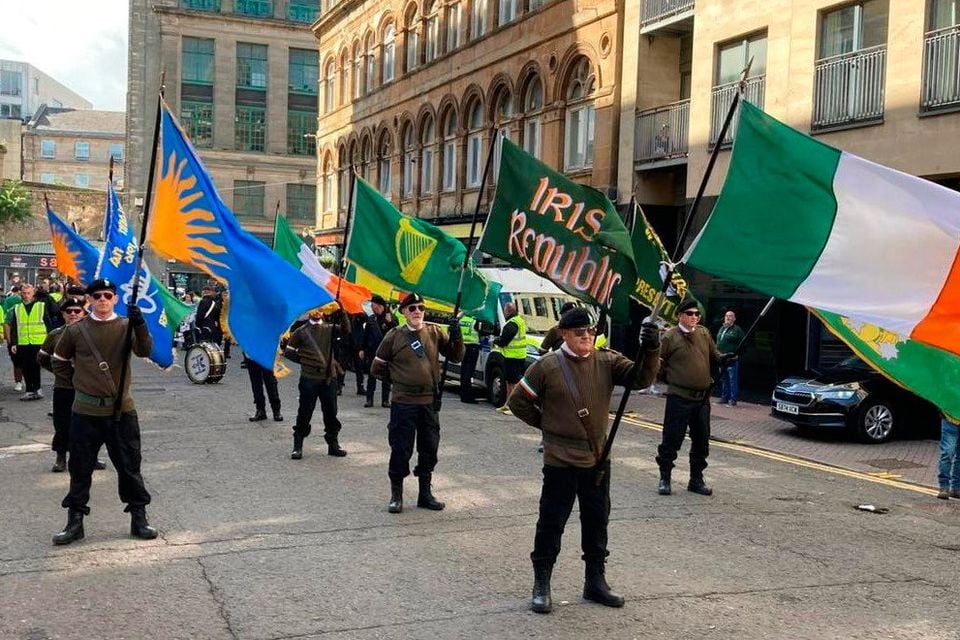 Men in paramilitary style uniforms at an anti-internment parade in Glasgow on 9 August 2025