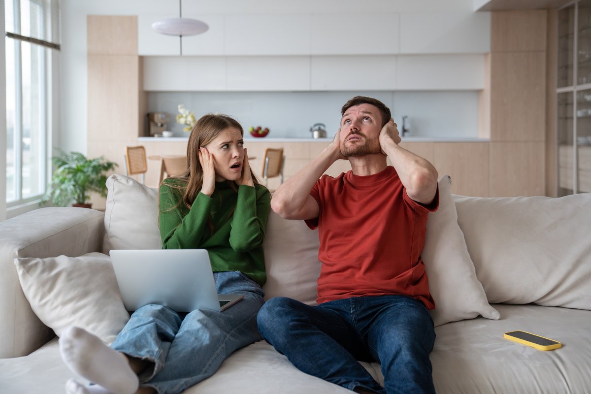 A couple react to noise from apartment