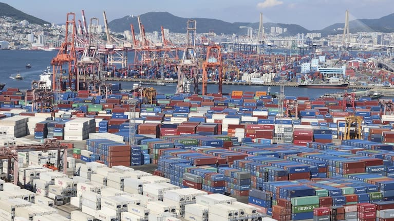 Cranes and shipping containers are seen at a port in Busan, South Korea, Thursday, July 31, 2025.