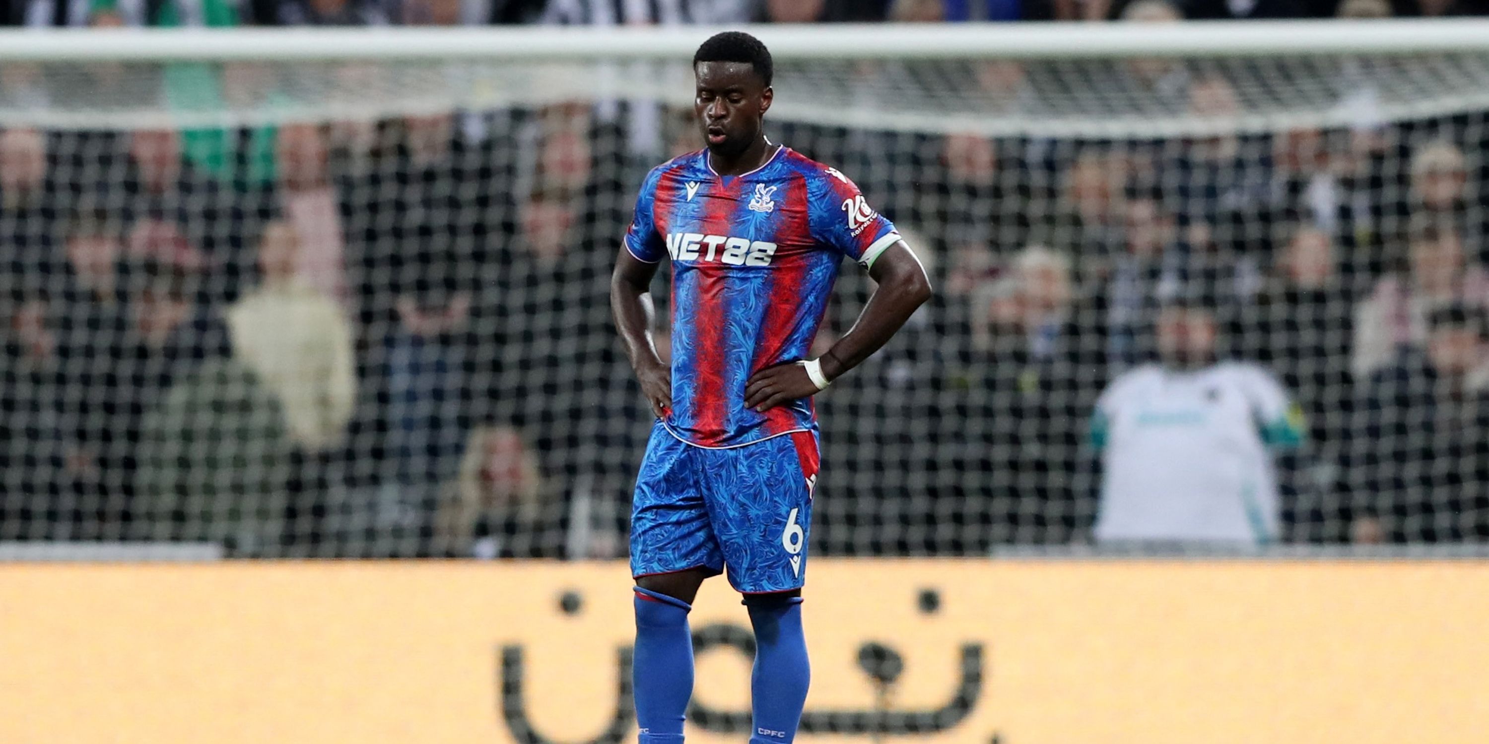 Crystal Palace's Marc Guehi looks dejected after Newcastle United's Harvey Barnes scores their third goal