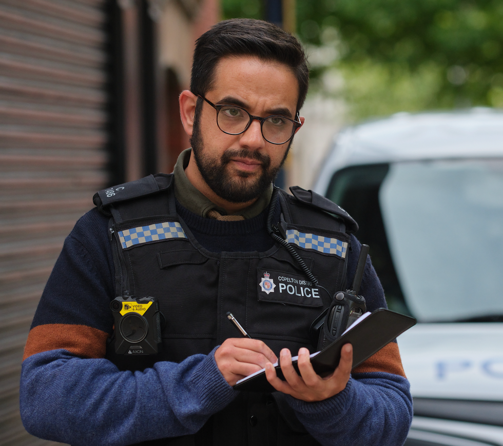 police officer taking notes on a notepad