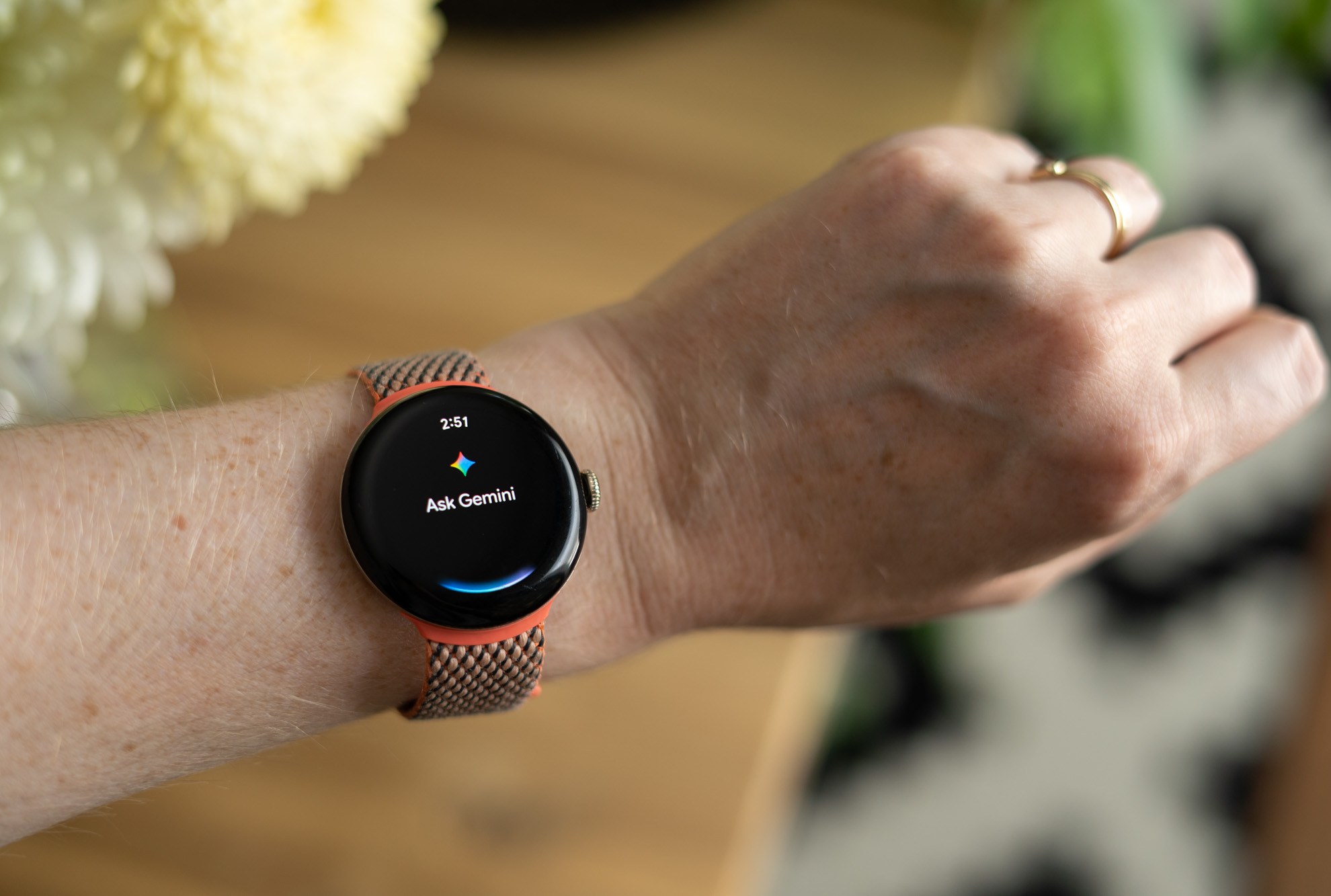 Google Pixel Watch 2 on wrist showing Gemini Assistant.