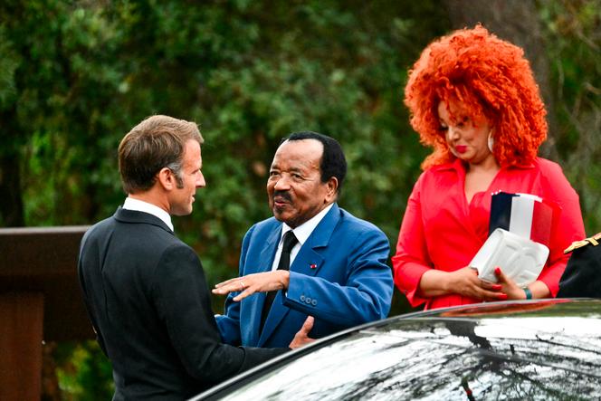 French President Emmanuel Macron (L) welcomes Cameroon's President Paul Biya and his wife, Chantal Biya,  in south-eastern France, on August 15, 2024.