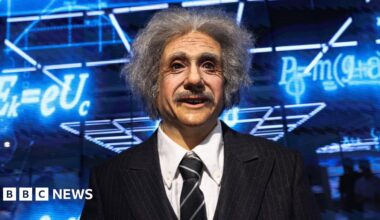 A humanoid robot in the likeness of late physicist Albert Einstein stands behind a price tag, during an organised media tour to Robot Mall, a store selling humanoid and other robots, in Beijing.