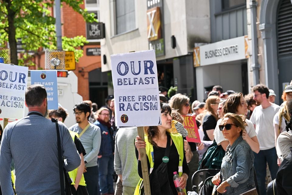 General view of counter-protestors who gather in opposition against a protest in Belfast city centre behind Belfast City Hall. Several dozen anti asylum seeker  protestors gathered outside a Belfast hotel. Photo by  Press Eye.