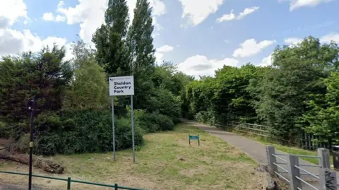 Google A google street view image of a park with a large sign that says Sheldon Country Park