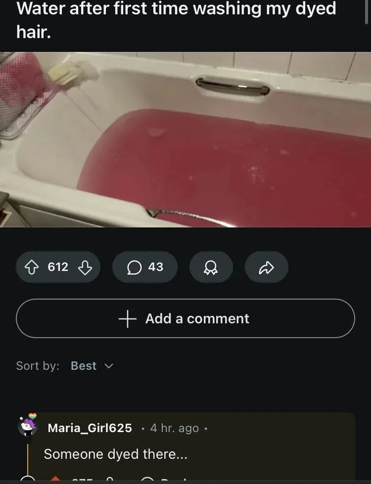 Bathtub filled with tinted water from hair dye; humorous comment notes someone's hair dye