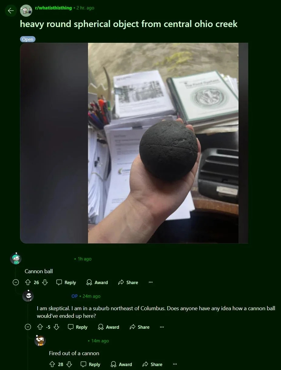 Person holding a heavy, round object suspected to be a cannonball, with discussions about its origin below