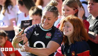 England's Natasha Hunt takes a selfie with a fan