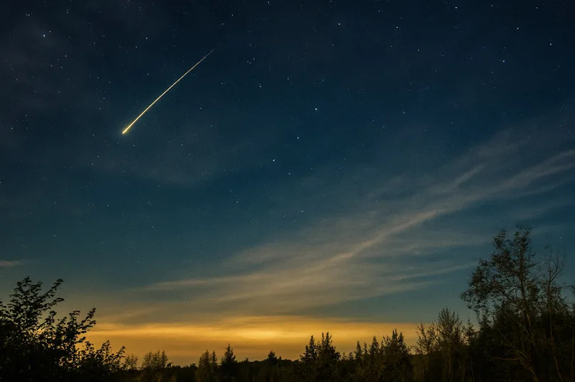 A meteor shower in the night sky
