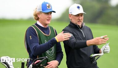 Luke Poulter and Ian Poulter discuss a shot during a pro-am tournament