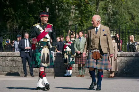 PA Media King Charles III inspects the Balaklava Company, 5th Battalion, The Royal Regiment of Scotland, at the gates of Balmoral, as he takes up summer residence at the castle. Picture date: Monday August 18, 2025. PA Photo. Photo credit should read: Jane Barlow/PA Wire