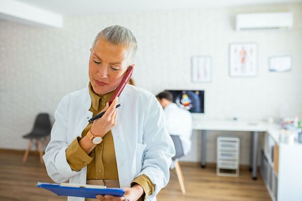 Female doctor talking to her patient on phone
