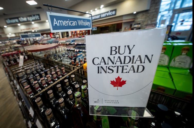A sign in a liquor store that reads 