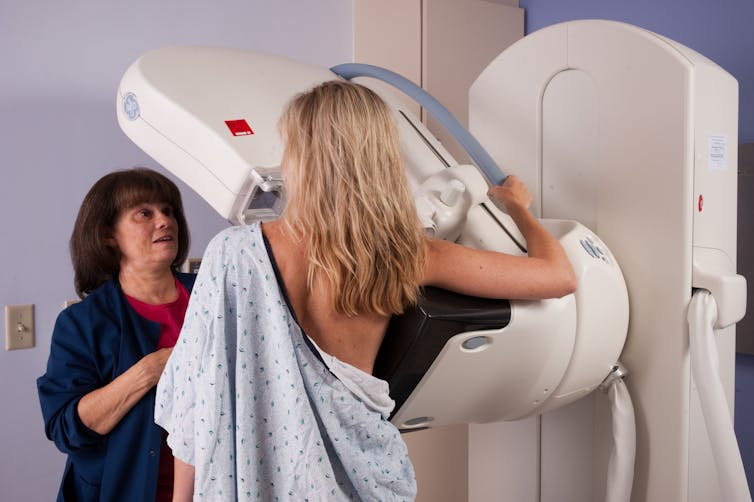 A woman undergoing mammography.